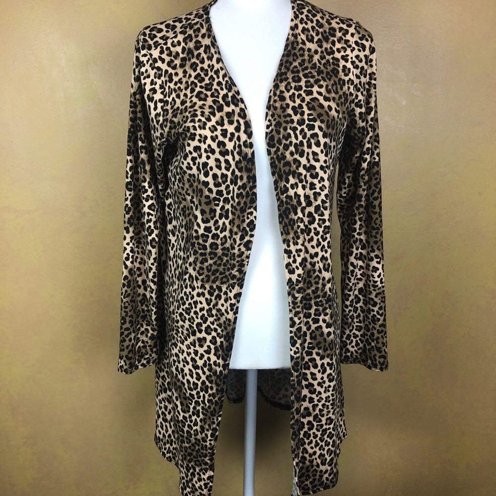 Large pull on tiger look material. Nice light cover up. Used but hardly wore.